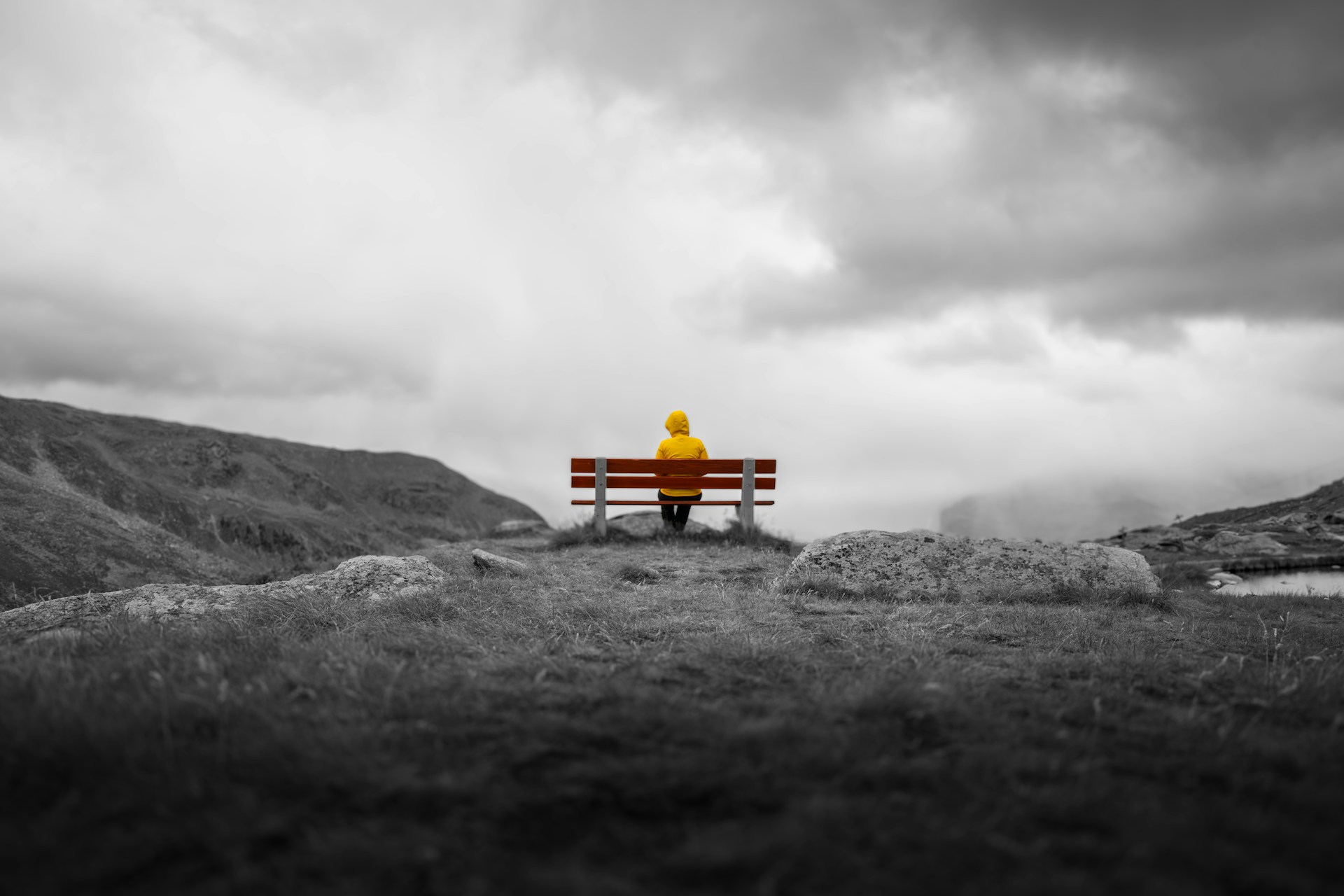 A developer in silhouette in front of a mountain